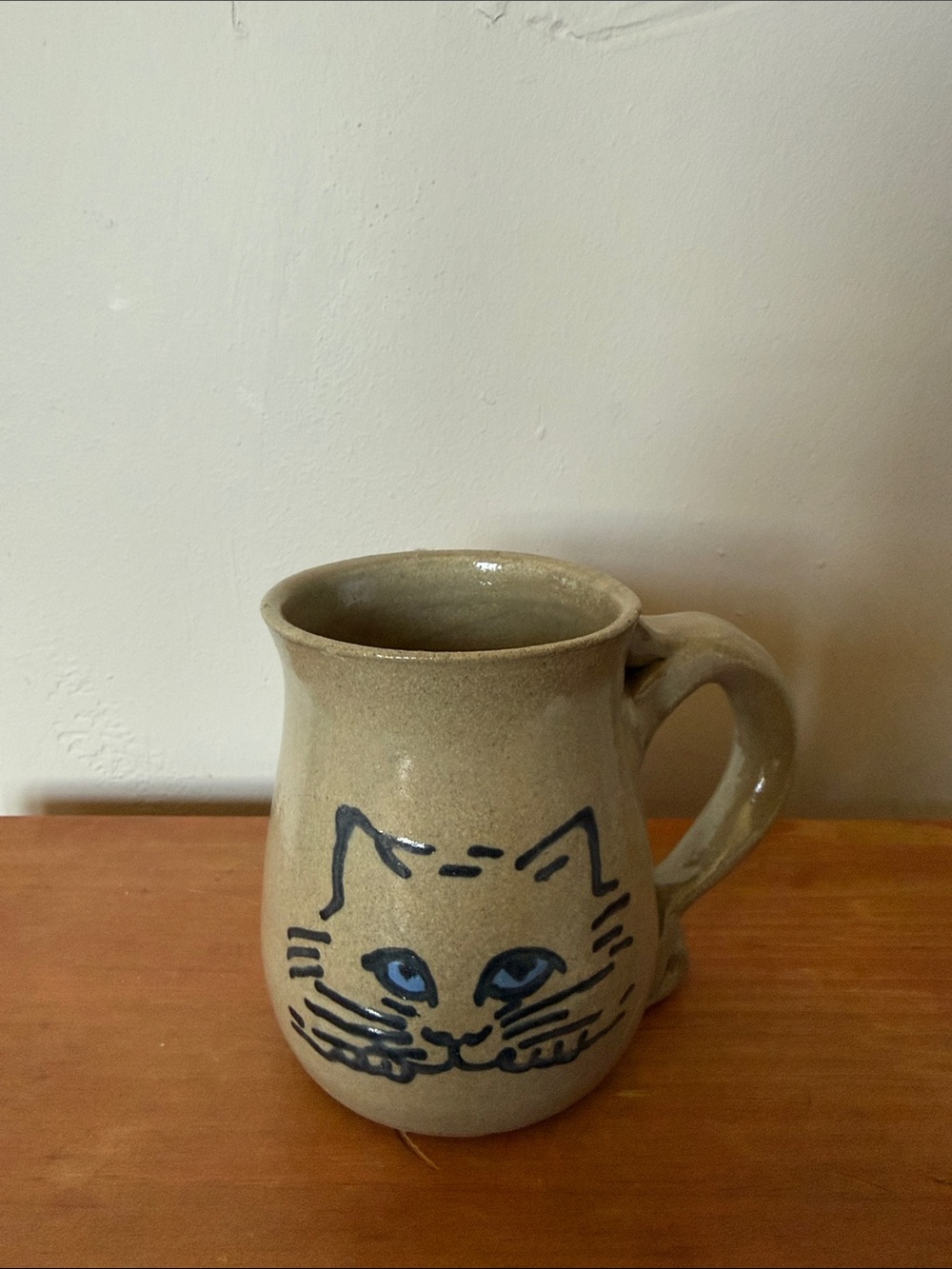Handcrafted Beige Cat Ceramic Mug with Blue Accent
